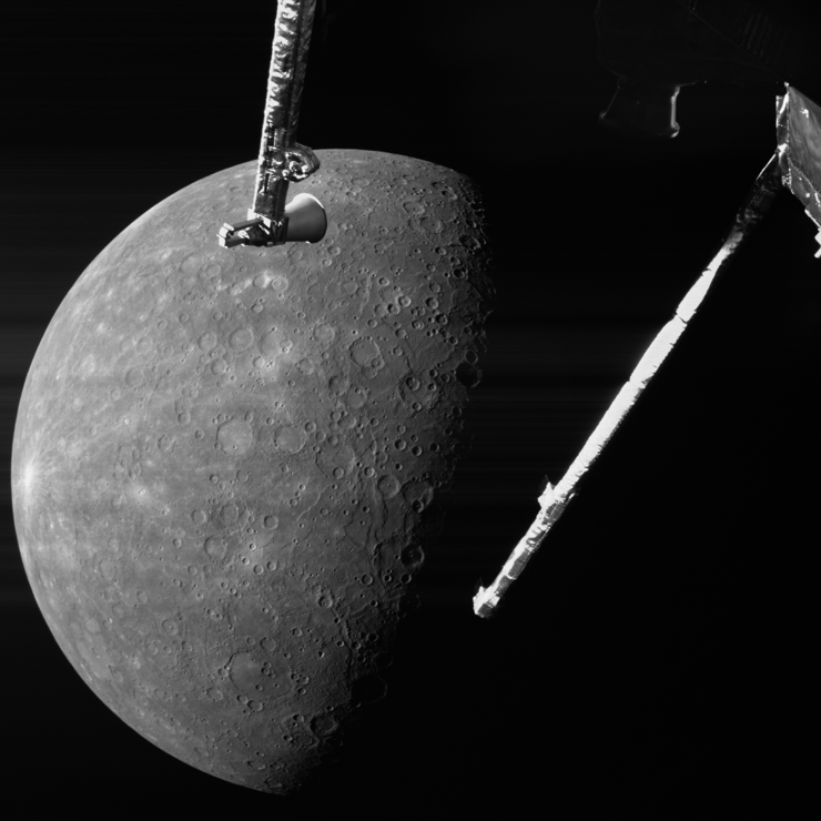 A black and white picture of the planet Mercury, a heavily cratered body, with some parts of the BepiColombo spacecraft in the foreground.